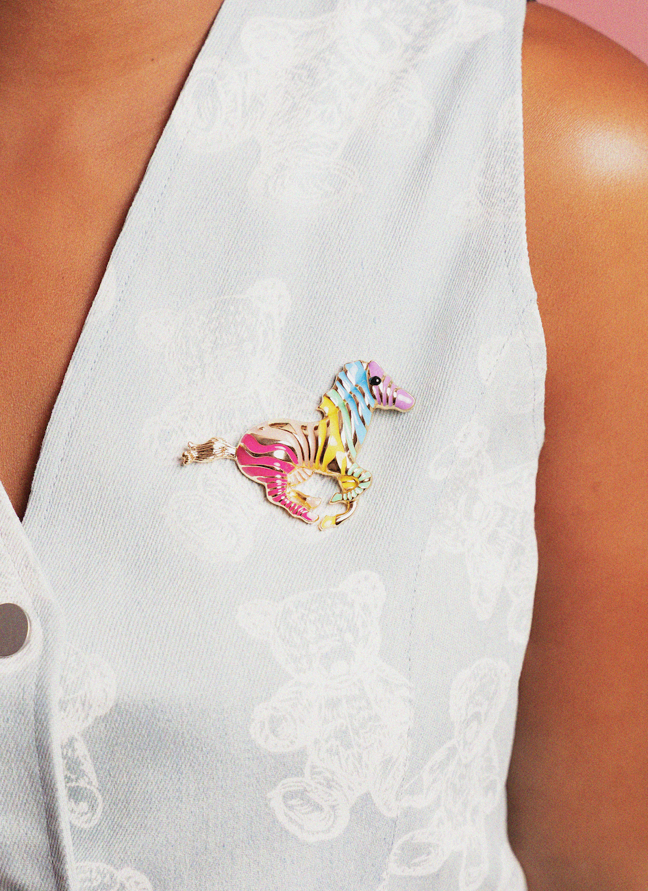 Colorful Zebra Brooch on a white sleeveless top