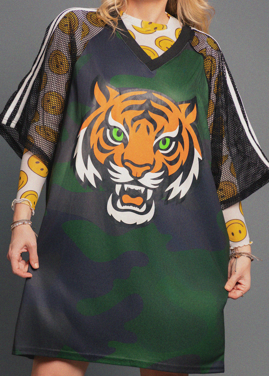 Green and black dress with a tiger design on a gray background